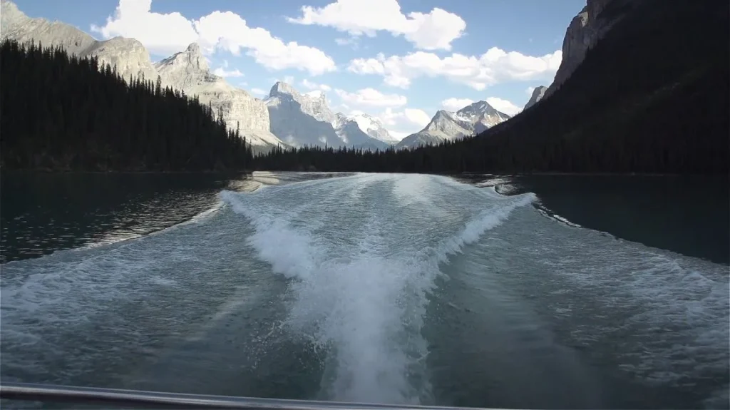 boat on turquoise lake from distance