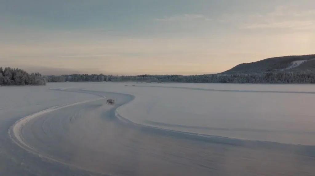 car drifting on frozen lake