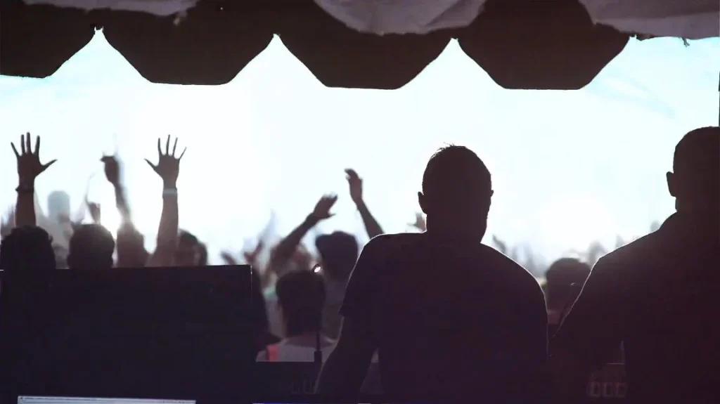 festival tent crowd silhouettes