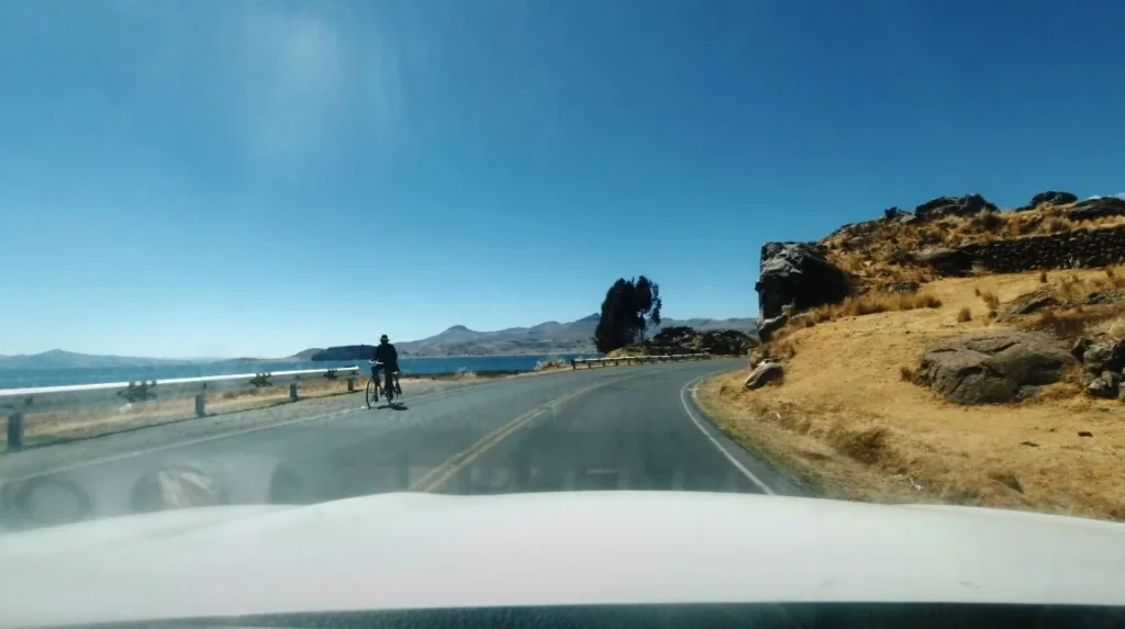 long road with cyclist