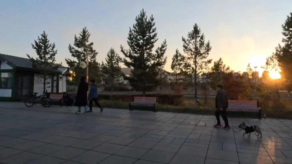 park at sunset with people