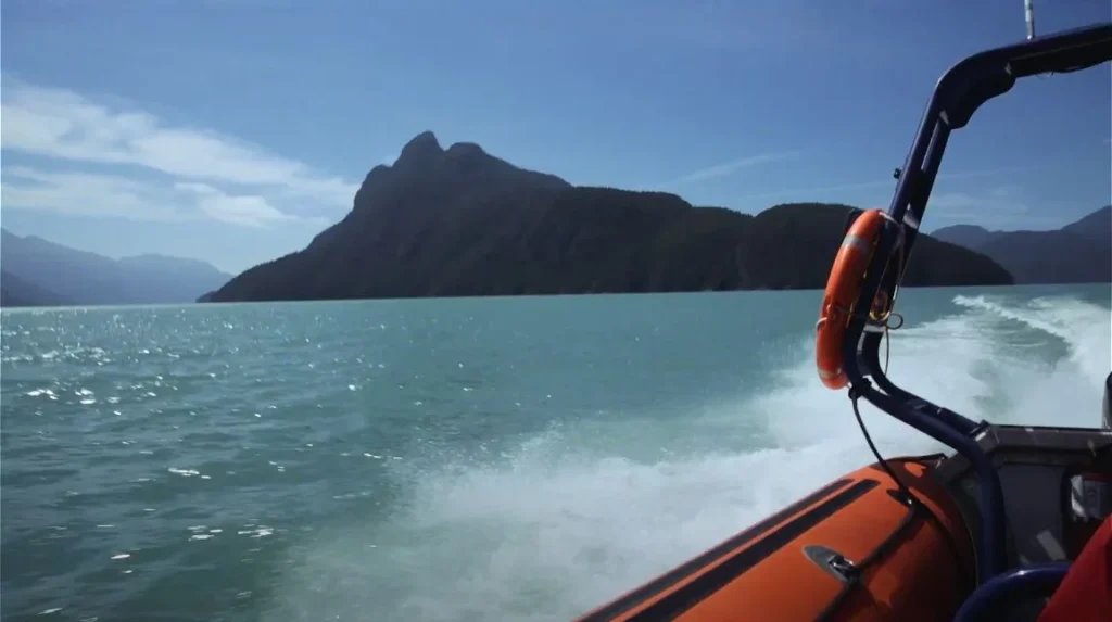 wake behind boat on turquoise lake
