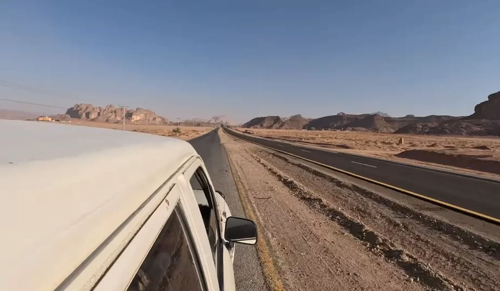 Tourists on open jeep in desert
