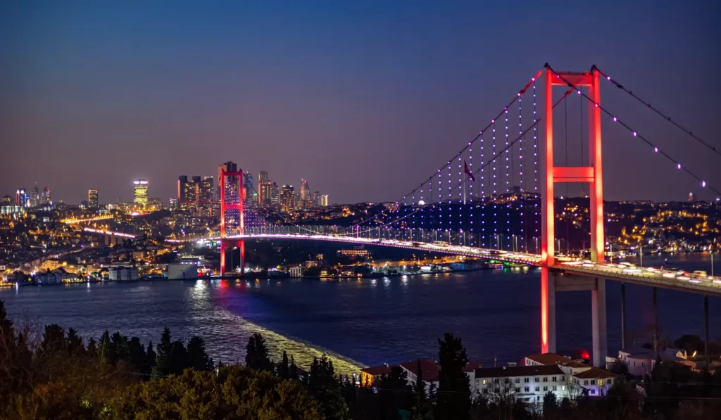 Bosphorus Bridge illuminated in red at night