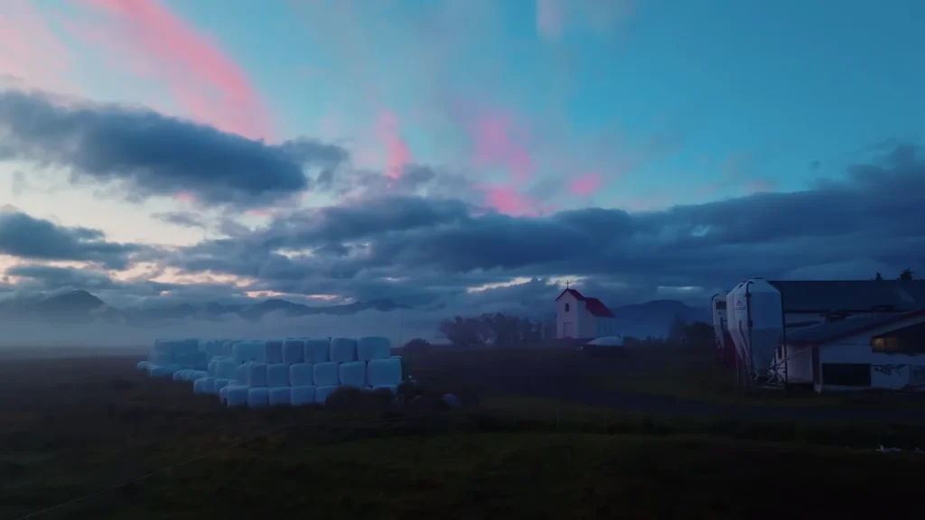 Farm with church at dusk