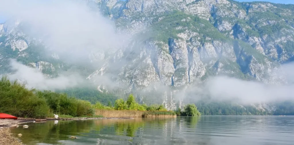 Bohinj misty morning, red kayak