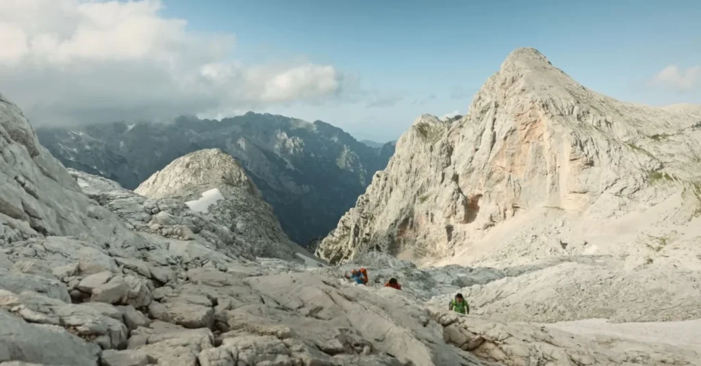 Climbers on raw rock face, Triglav range