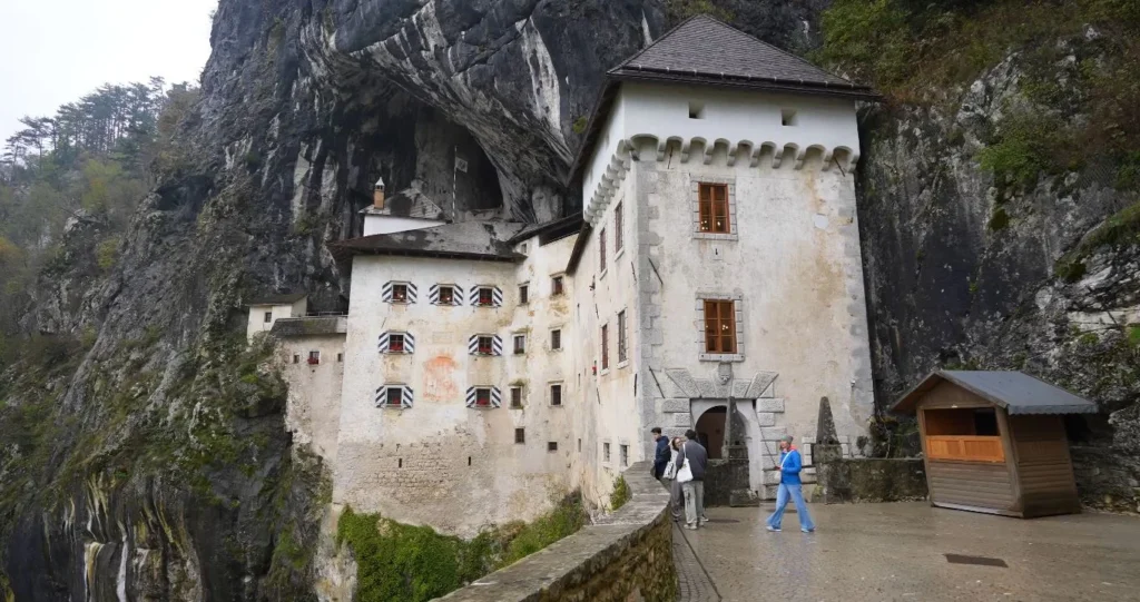 Predjama Castle entrance, visitors