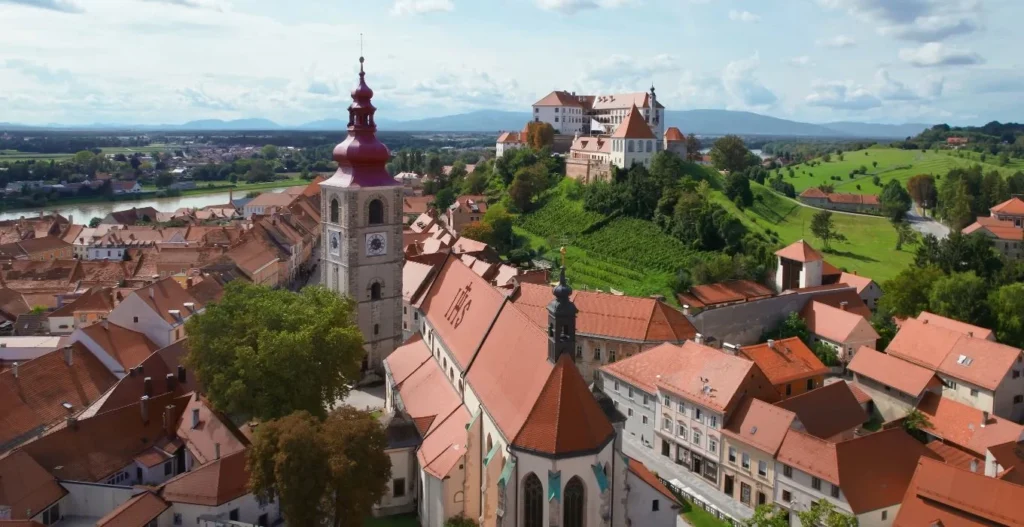 Ptuj aerial, castle on hill, Drava river