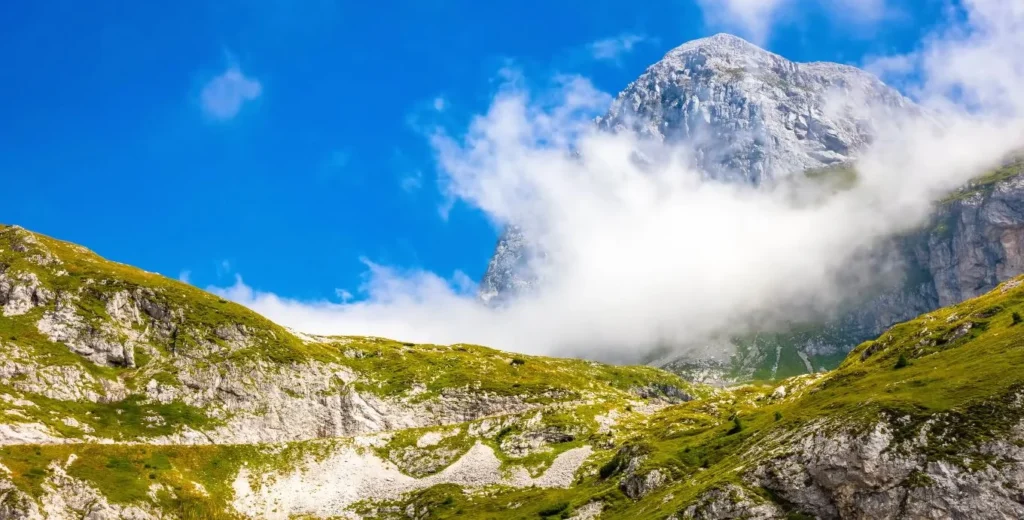 Triglav peak through cloud, upward angle